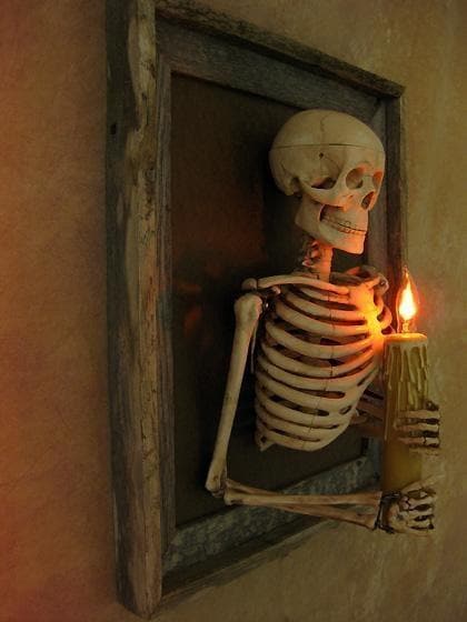"Framed 3D Skeleton Torso Holding Candle" Hanging Haunted House Decoration