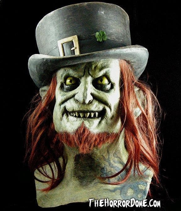 Lucky Leprechaun Halloween Mask from HD Studios Pro. Dark, depraved interpretation of classic character featuring scary teeth and crazed eyes. Incredibly detailed collector's mask with seamless over-head fit. Perfect for embodying sinister side of folklore icons