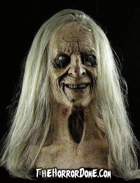 Witchy Woman Halloween mask by The Horror Dome. Original design of grotesque forest witch with chilling realistic details like dead eyes, rotting teeth, tangled hair. Made in USA. Features comfortable lightweight construction perfect for completing witch costume ideas.